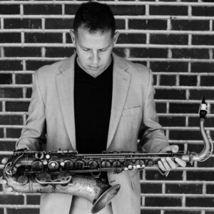 Geoff Vidal, a jazz saxophonist and educator from New York, has released acclaimed music and leads the Analog Jazz Orchestra, showcasing his talent in the jazz scene.