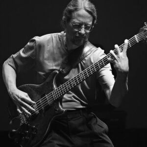 Jimmy Johnson, an acclaimed American bass guitarist, is known for his work with James Taylor and Allan Holdsworth, and for his contributions to the development of the 5-string bass guitar.