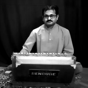 Madhusoodan U Bhat is a renowned harmonium player in Indian classical music, known for his collaborations with esteemed artists and mastery of the instrument.