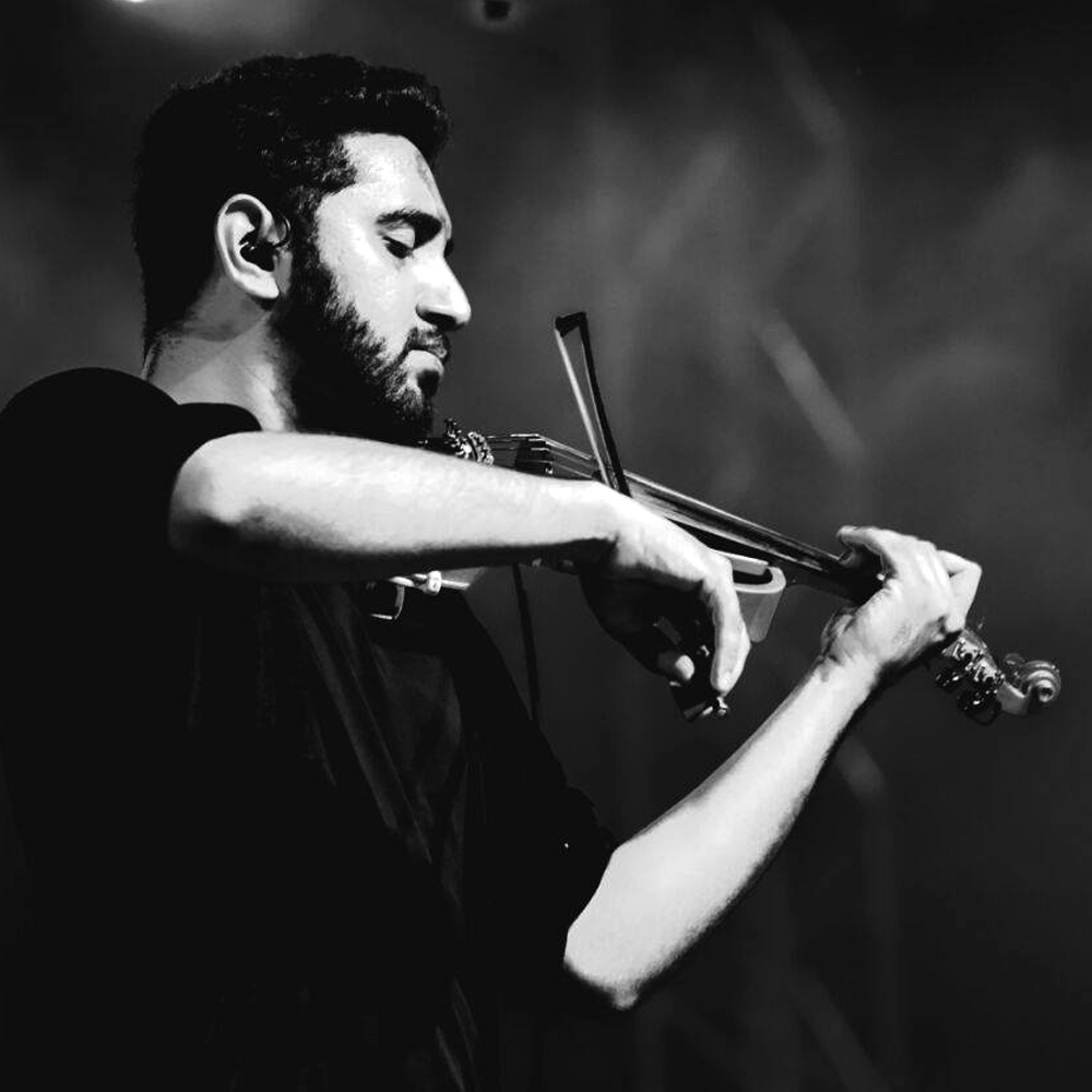 Shravan Sridhar, a skilled violinist and vocalist, blends Carnatic music with various genres, performing at prestigious events and collaborating with renowned artists in the Indian music scene.