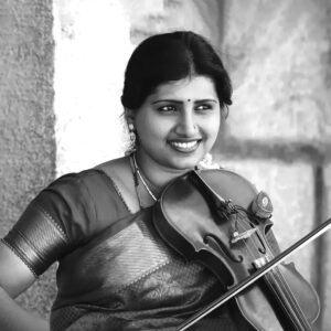 Smt. Sindhu Suchethan is a renowned Carnatic musician, skilled in vocals and violin, celebrated for her performances and numerous awards.