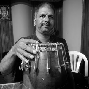 Sri. Srihari Rangaswamy, a skilled percussionist, excels in multiple instruments and has been a prominent figure in Indian classical music, performing extensively and contributing to dance projects.