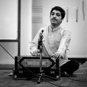 Surya Upadhyaya is a harmonium player trained by notable maestros, recognized for his performances with esteemed Hindustani vocalists and his versatility in music.