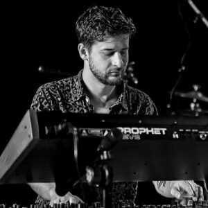 Thomson Knoles, an Australian jazz pianist and producer, blends eclectic sounds and influences while performing with various bands and producing music, including for Nike.